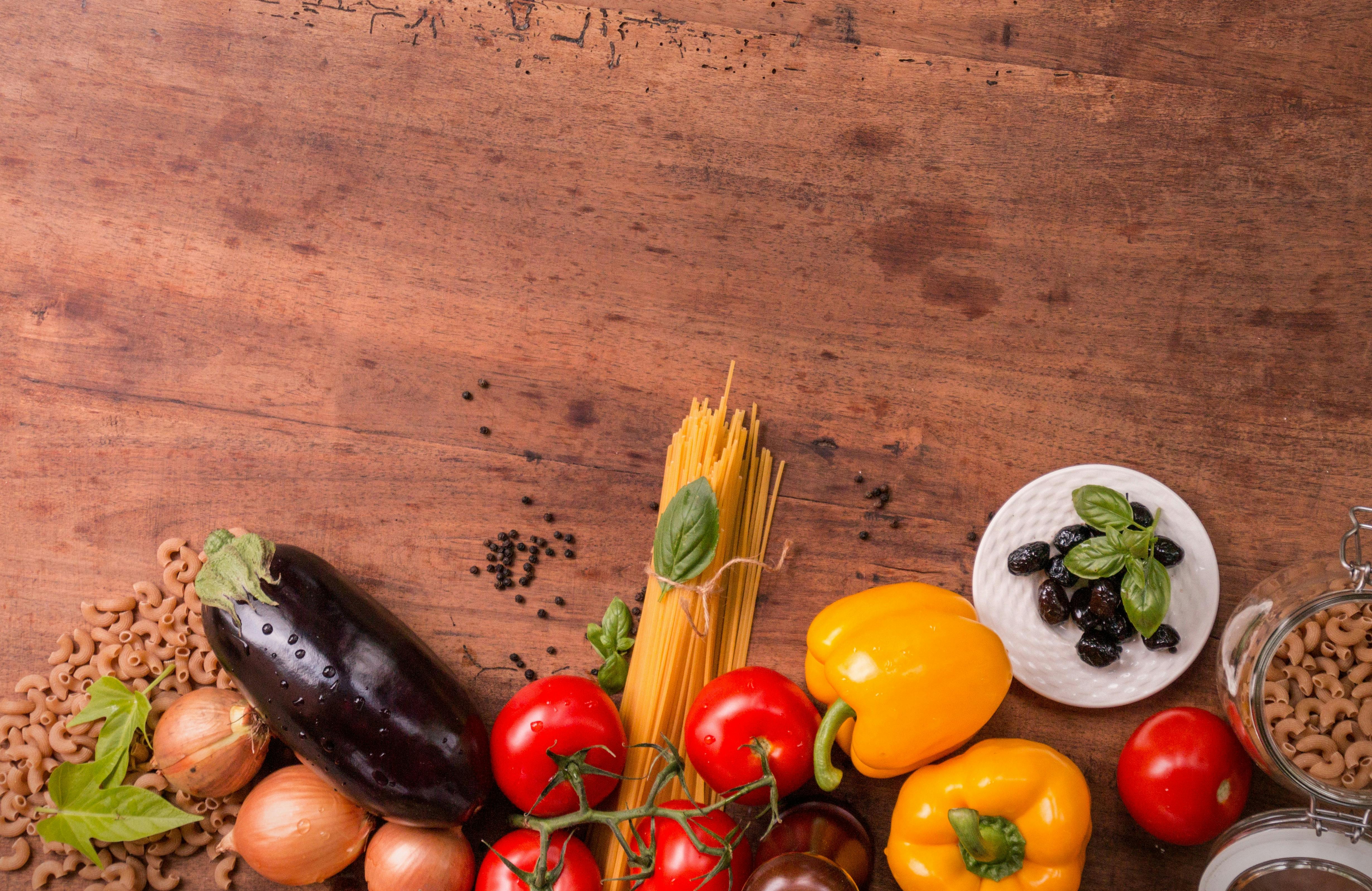 vegetables An assortment of vegetables atop a wooden counter